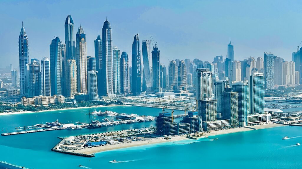 A breathtaking aerial view of Dubai's skyline with modern skyscrapers and the vibrant marina.
