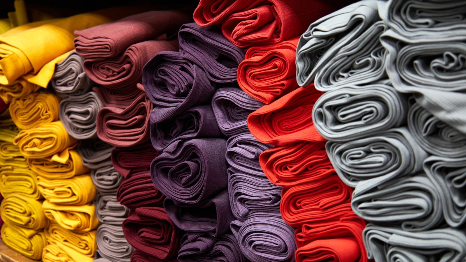 A close-up of white textile, showing the surface texture and whiteness level that a thobe fabric sample is judged against before approval